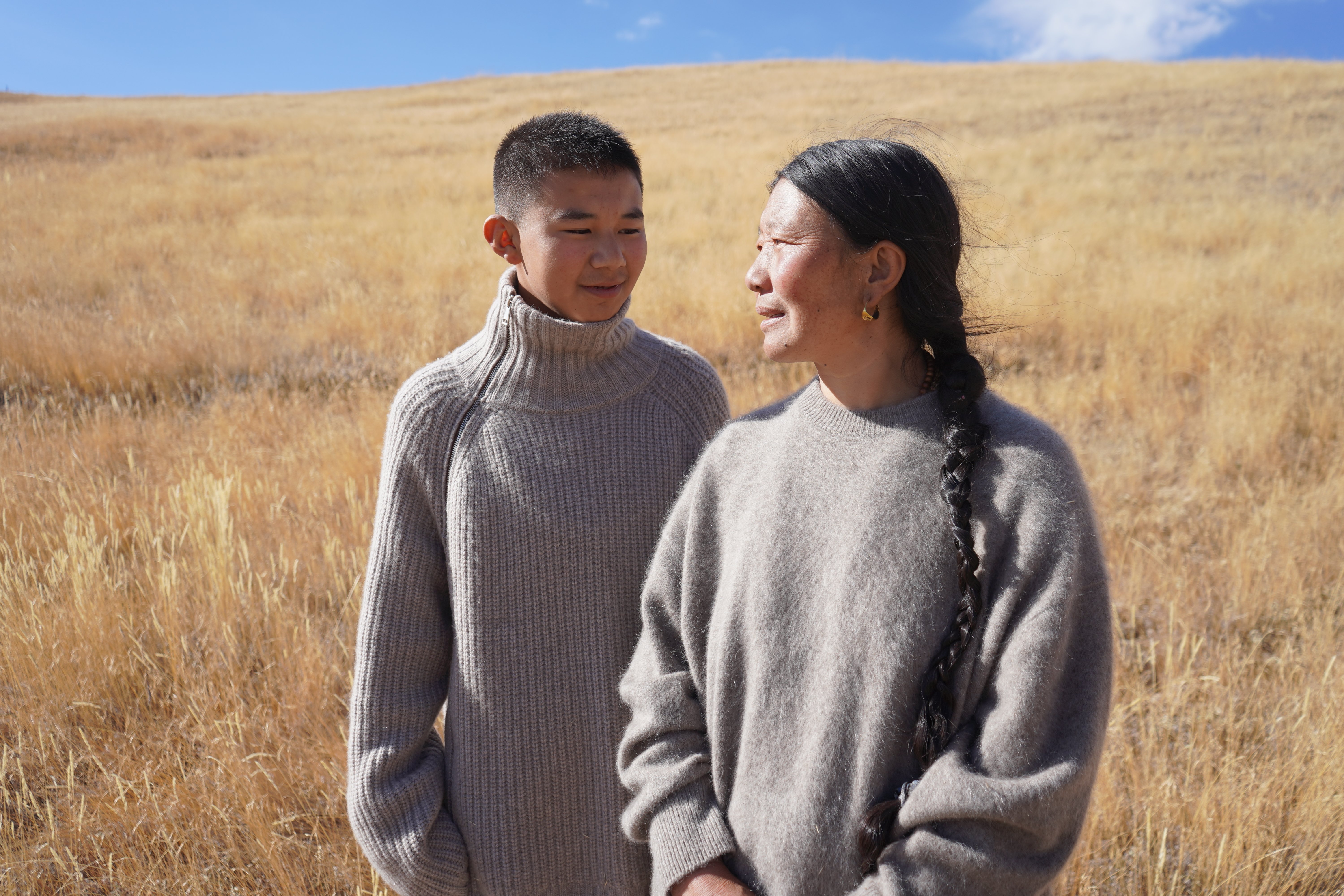 Couple standing in a golden field
